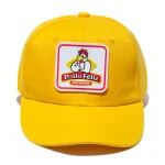 Gorra amarilla de Pollo Feliz.